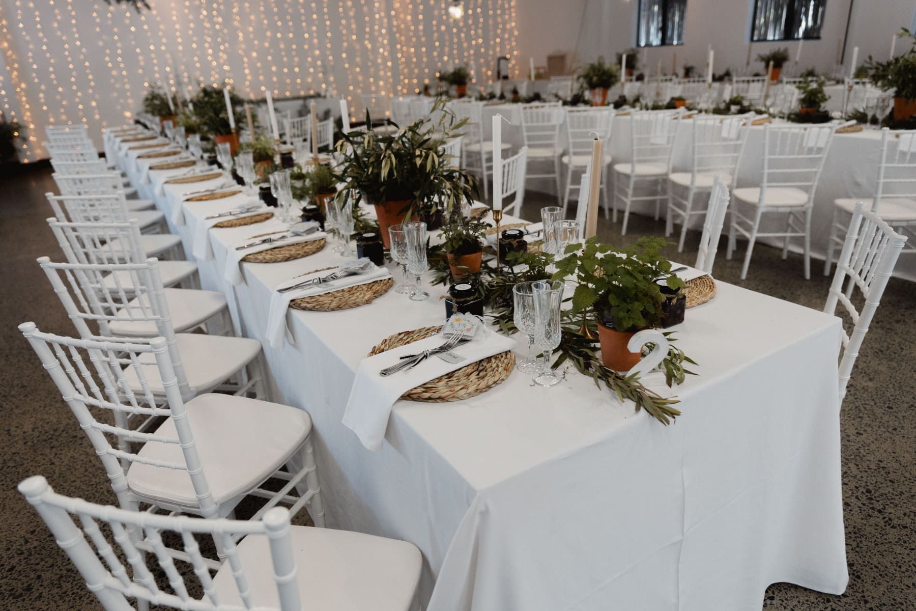 Long table setup with botanical styling